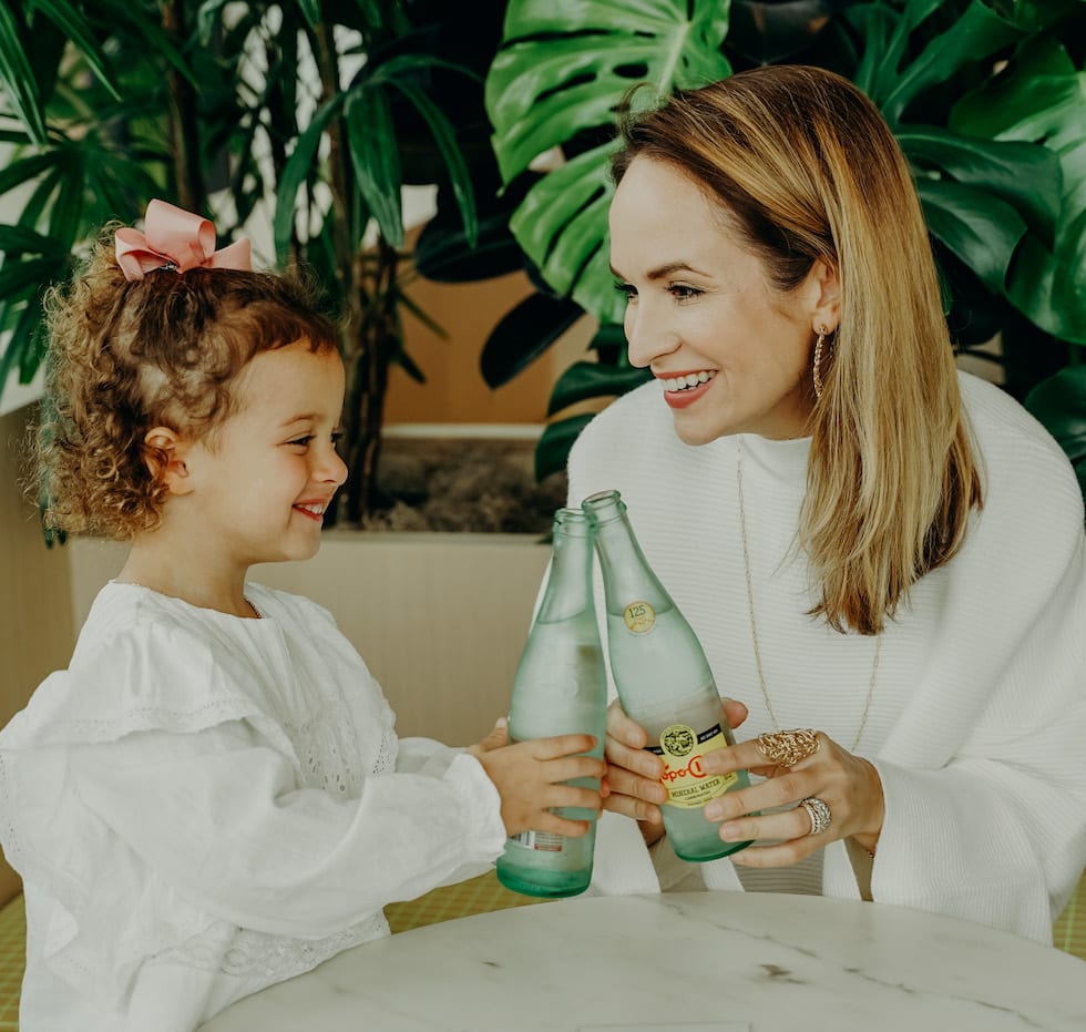 Family cheers with sparkling water